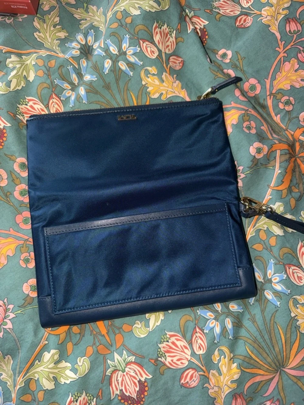 Tumi Navy Fold-Over Wristlet Clutch with Gold Hardware